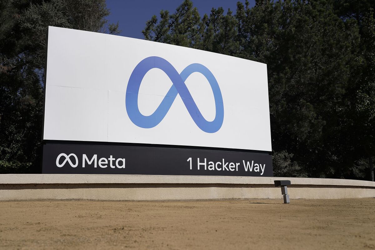 A sign marks Facebook parent Meta's company headquarters in Menlo Park, Calif.