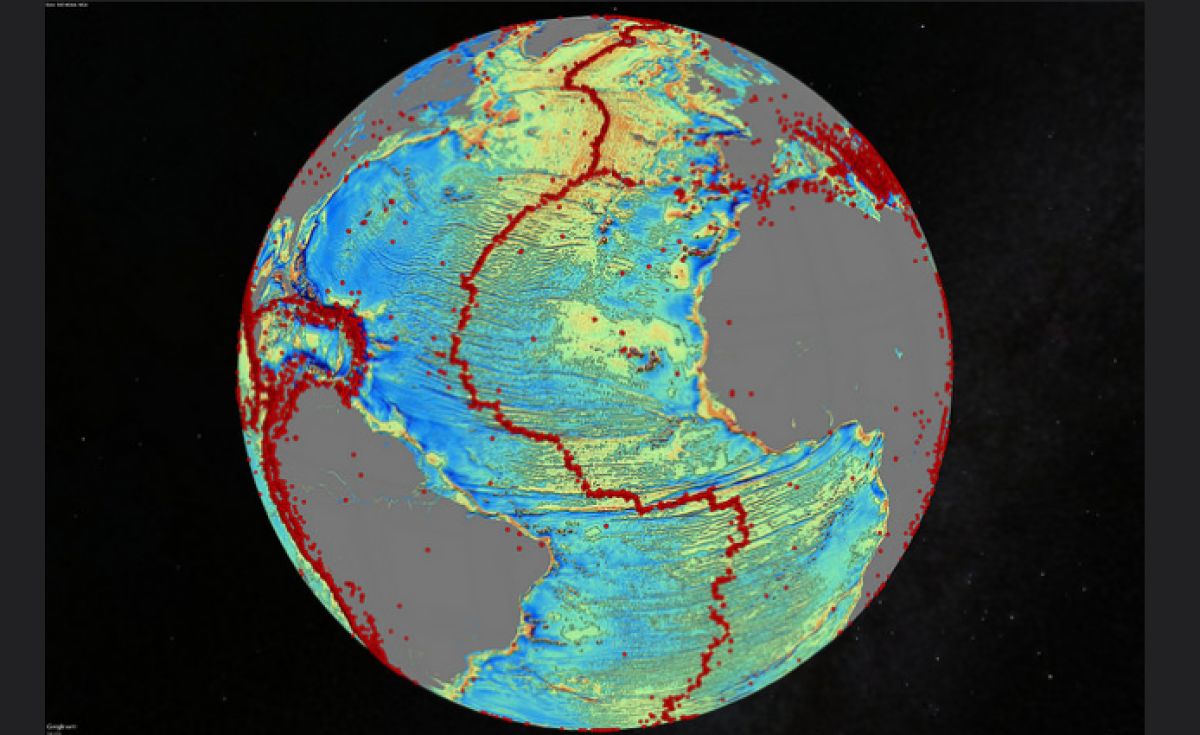 A marine gravity model of the North Atlantic. Red dots show locations of earthquakes with magnitude above 5.5 and highlight the location of seafloor ridges and faults.