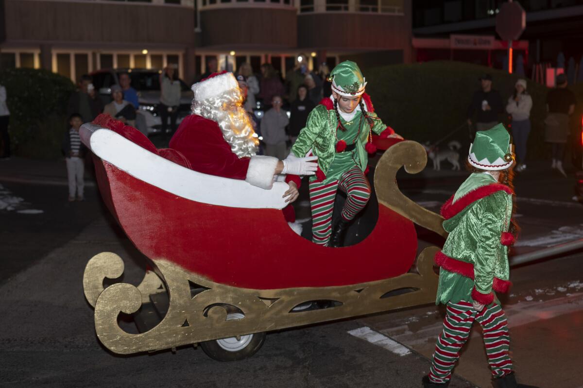 Santa and his elves arrive at Fletcher Cove at the Dec. 4 tree lighting event held in Solana Beach.