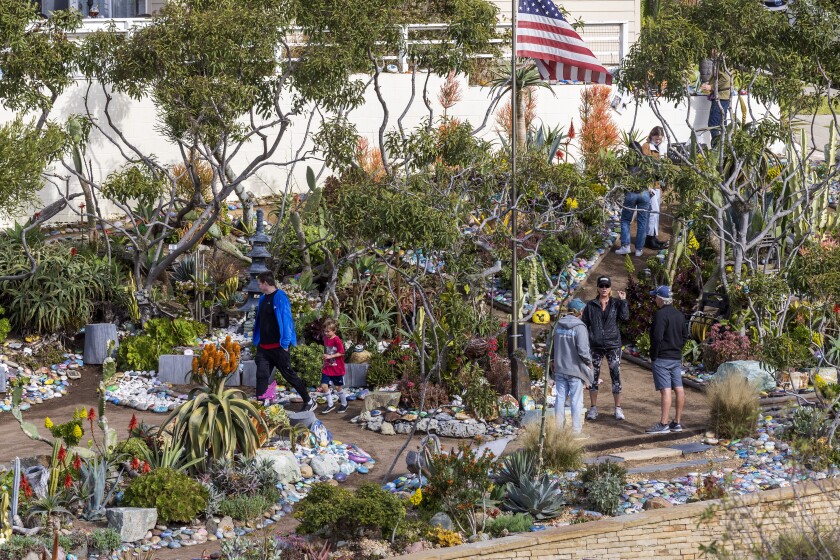 People walk through Dave's Rock Garden near Moonlight Beach in Encinitas on Saturday, January 8.