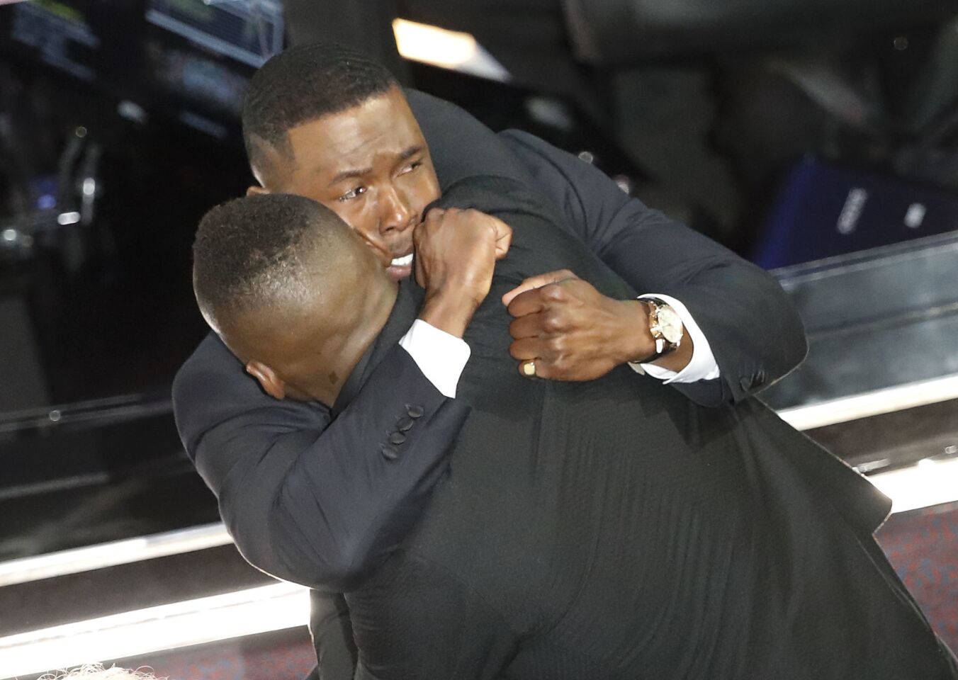 Trevante Rhodes hugs Mahershala Ali after "Moonlight" was correctly identified as the winner of best picture.