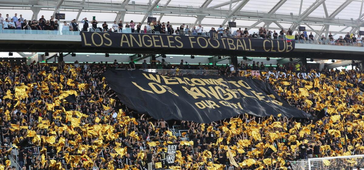 LAFC fans rally before a game against the Galaxy at the Banc of California Stadium.