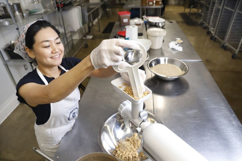 Ai Fujimoto mashes the soybeans at Crafted Kitchen, a commercial kitchen in Los Angeles.