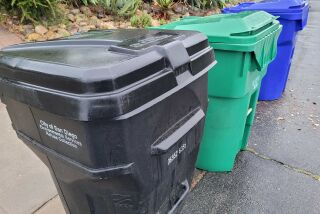 City of San Diego trash cans lined up for pickup.  