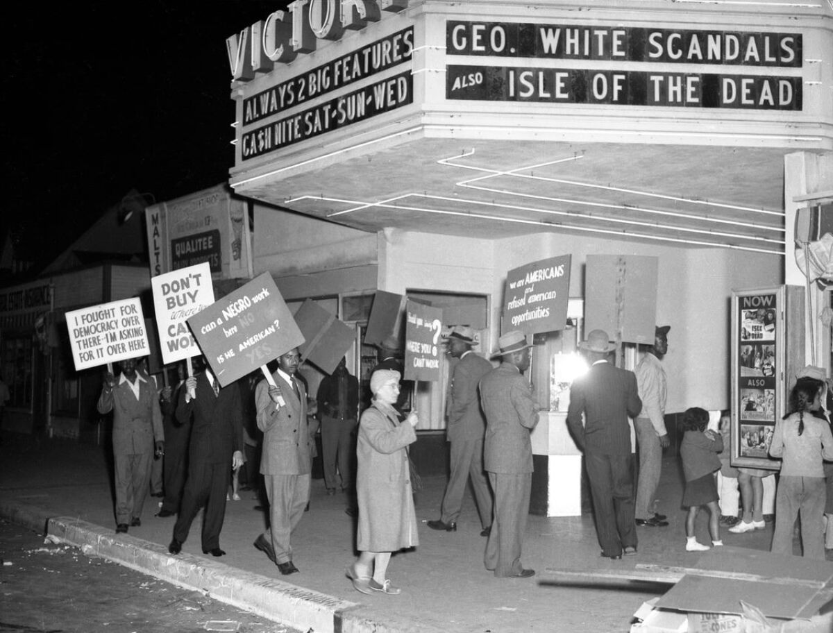 Picketing outside the Victory Theatre in 1945.