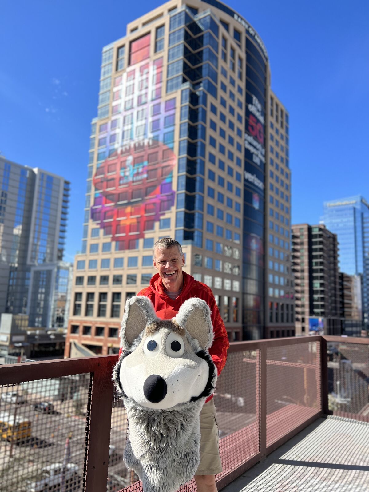 Dan Meers shows the head of KC Wolf,  mascot of the Chiefs, in downtown Phoenix.