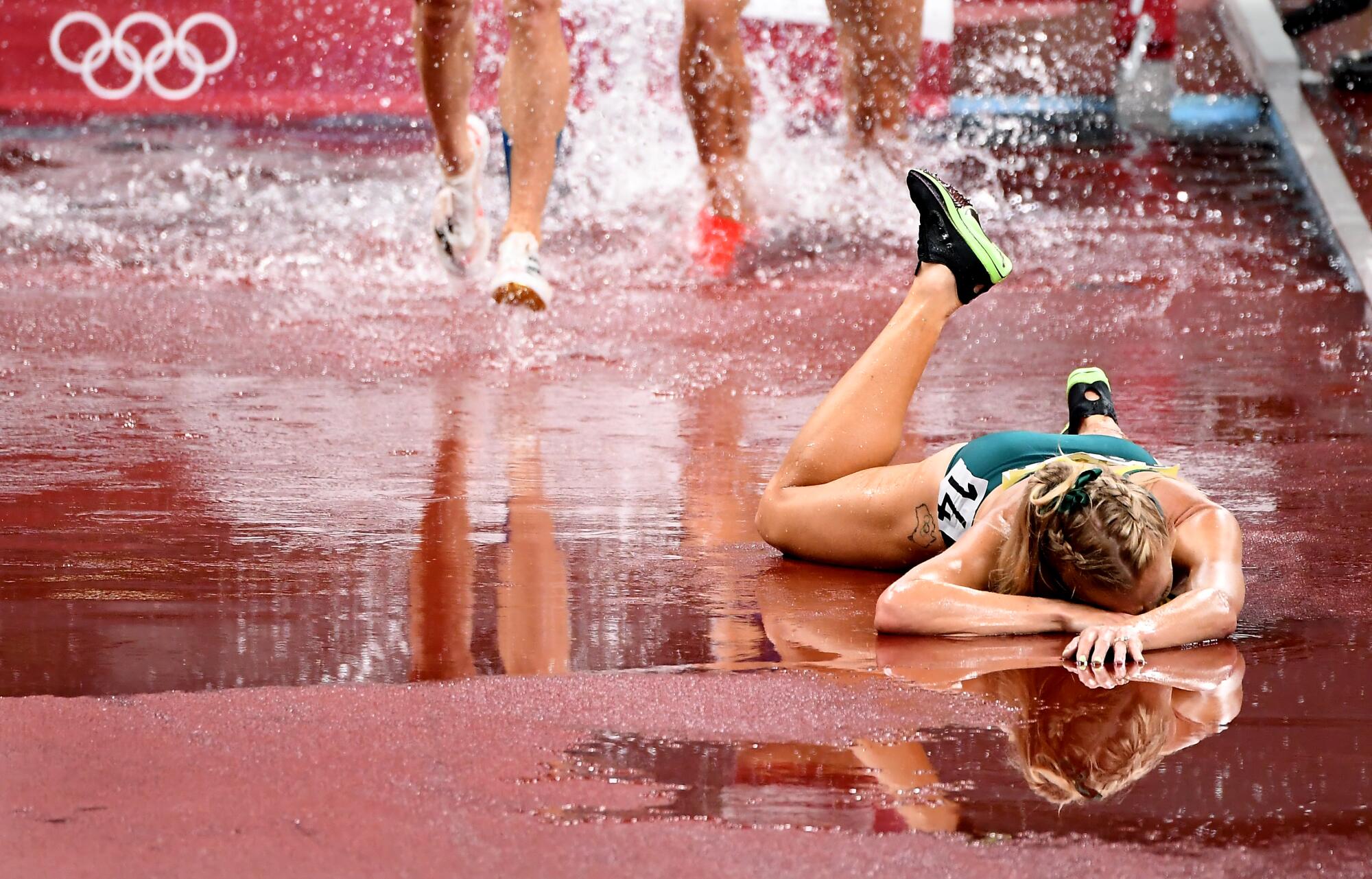 Australia's Genevieve Gregson injures her ankle during the women's 3000m steeplechase