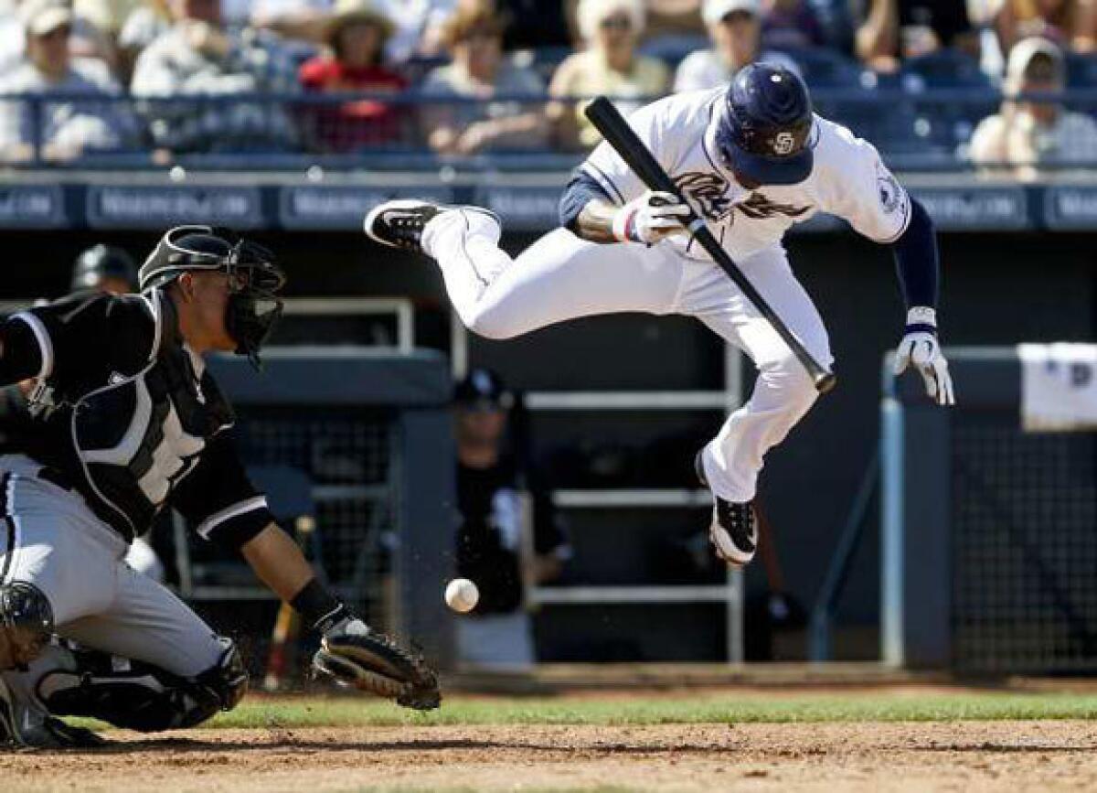 Orlando Hudson evades a ball while batting for the Padres in spring training this year.
