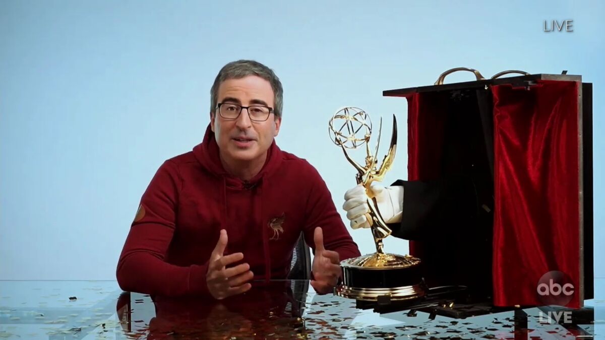 John Oliver with his Emmy.