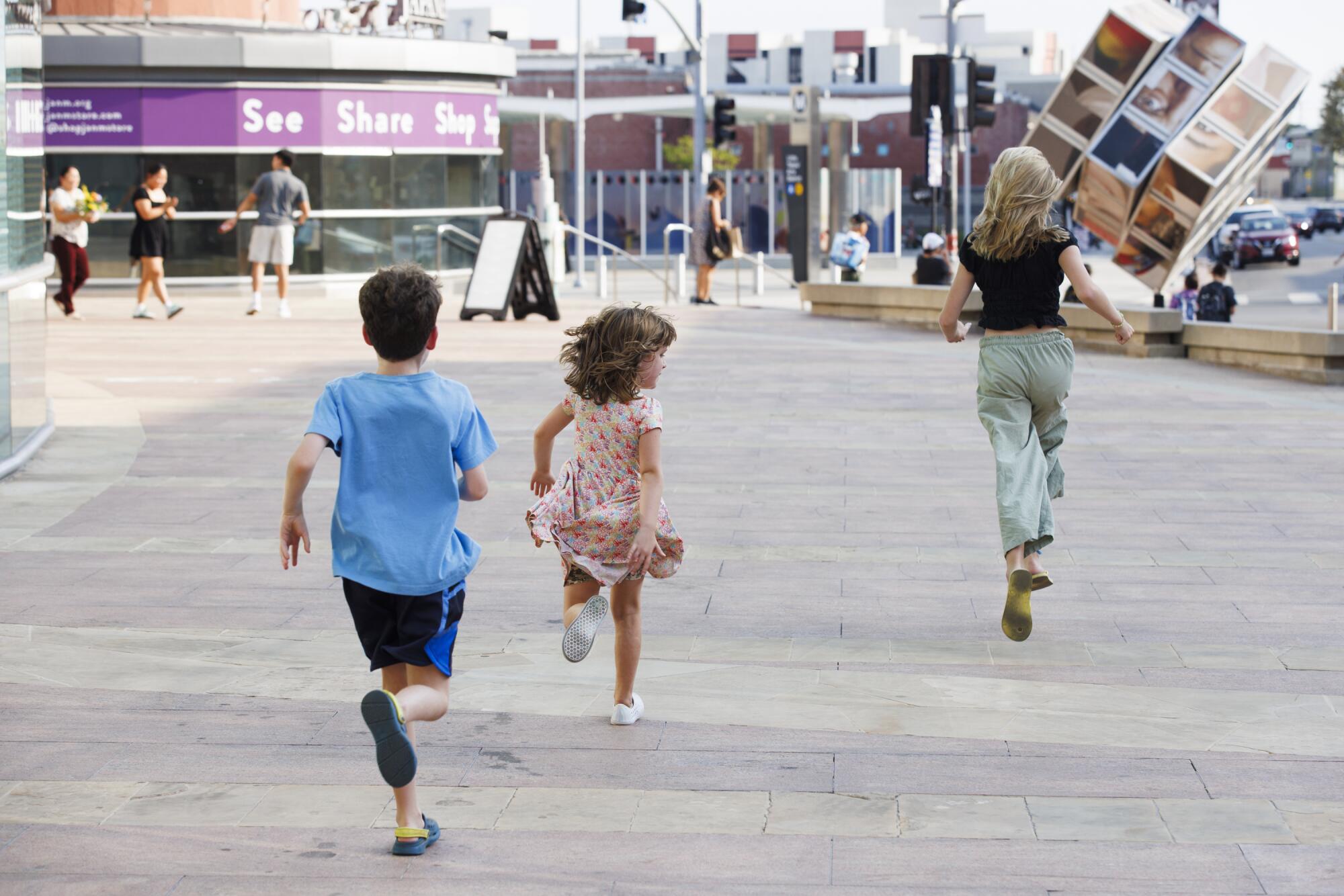 The Moran children run between places while playing. "Spies among us" in Little Tokyo.