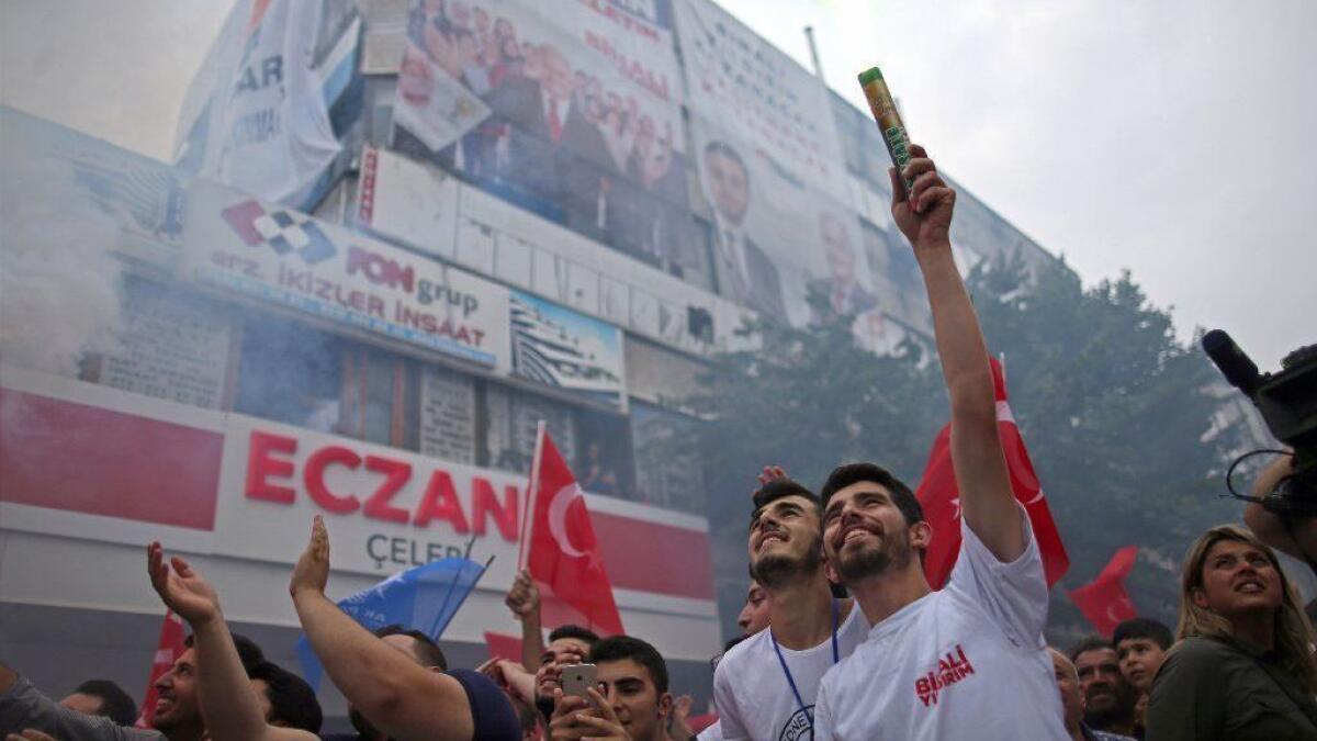 Supporters of the Turkish ruling party's mayoral candidate, Binali Yildirim, cheer at a campaign rally June 20 in Istanbul.