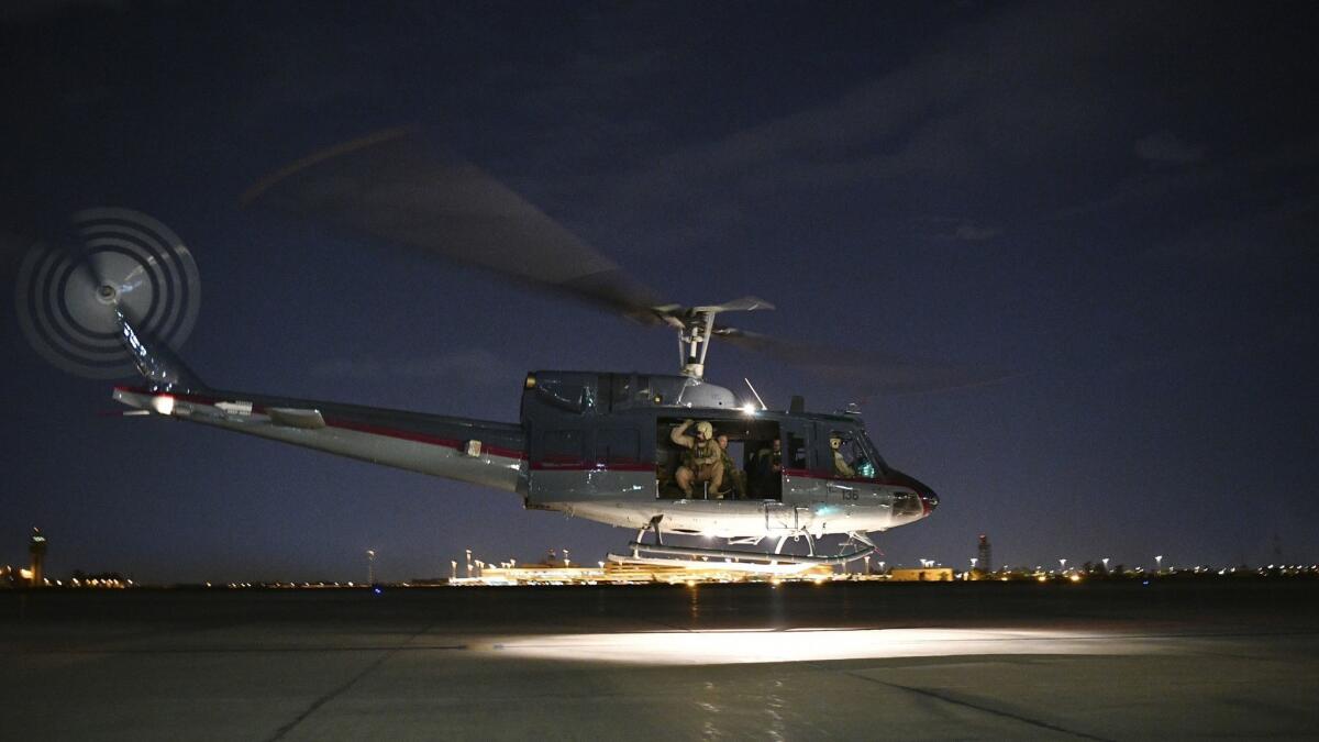 A helicopter carrying U.S. Secretary of State Michael R. Pompeo takes off from Baghdad on May 7, 2019, after he arrived for an unannounced visit.