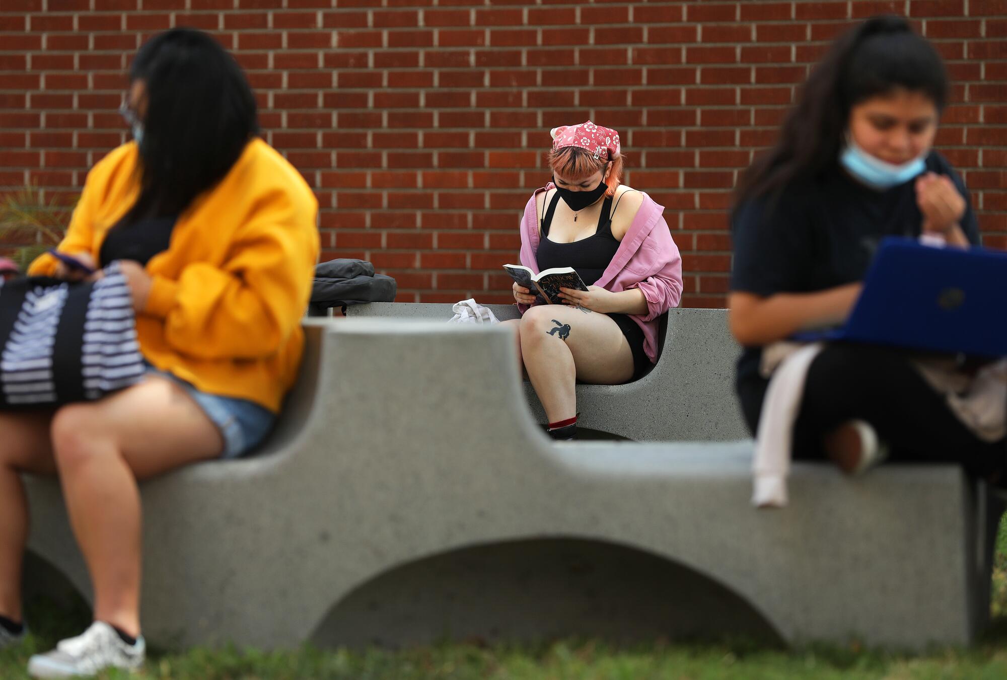 Students sit outside at Cal State L.A.