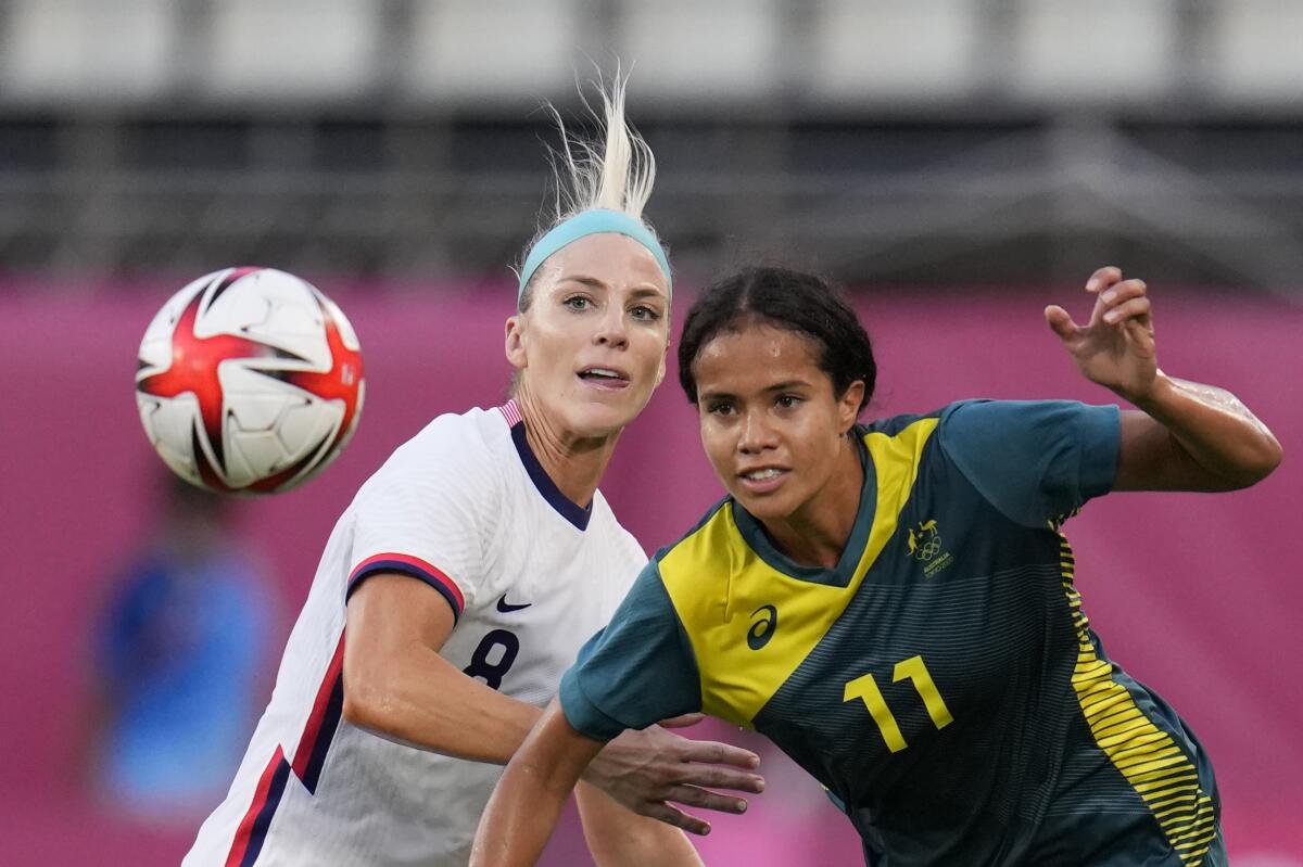 The USWNT's Julie Ertz and Australia's Mary Fowler chase the ball.