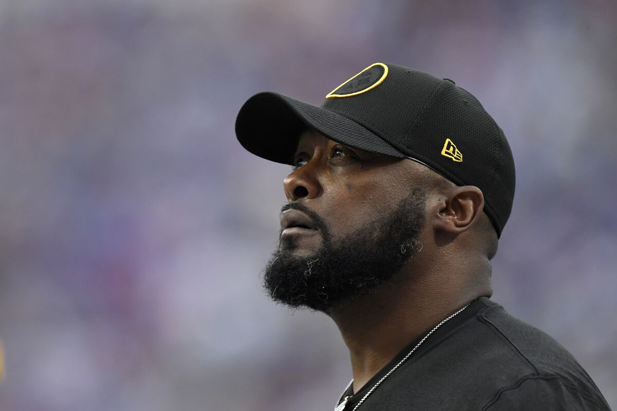 Pittsburgh Steelers' Mike Tomlin looks at the scoreboard during the second half of an NFL football game against the Buffalo Bills in Orchard Park, N.Y., Sunday, Sept. 12, 2021. (AP Photo/Joshua Bessex)