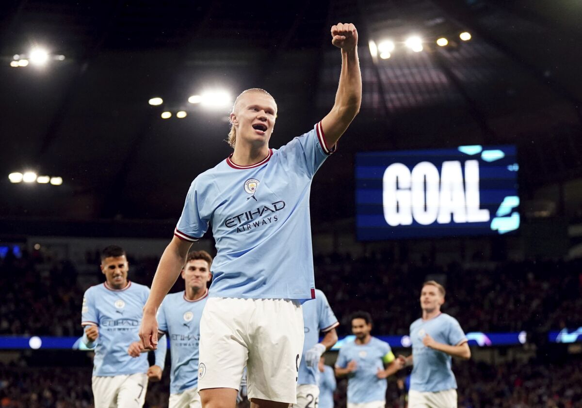Manchester City's Erling Haaland celebrates after scoring his side's opening goal during the Champions League soccer match between Manchester City and FC Copenhagen at the Etihad stadium in Manchester, England, Wednesday, Oct. 5, 2022. (Nick Potts/PA via AP)
