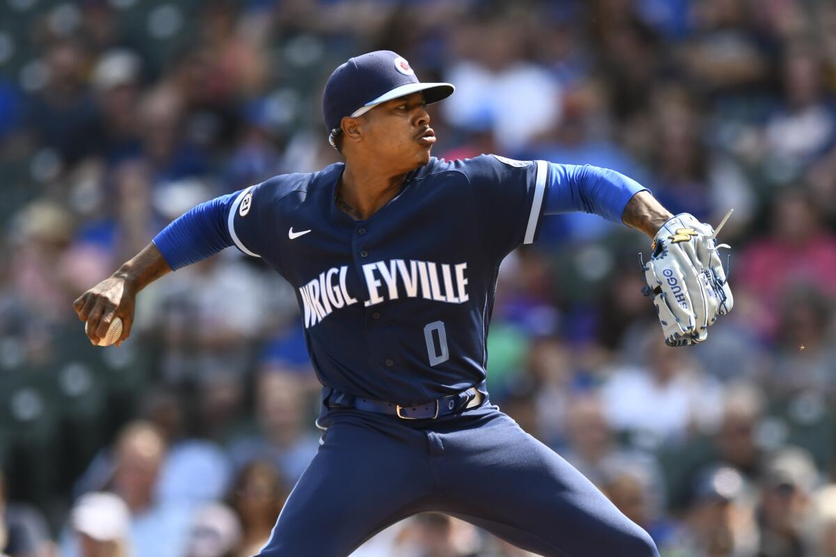 Chicago Cubs starter Marcus Stroman delivers a pitch during the first inning of a baseball game against the Colorado Rockies, Friday, Sept. 16, 2022, in Chicago. (AP Photo/Paul Beaty)