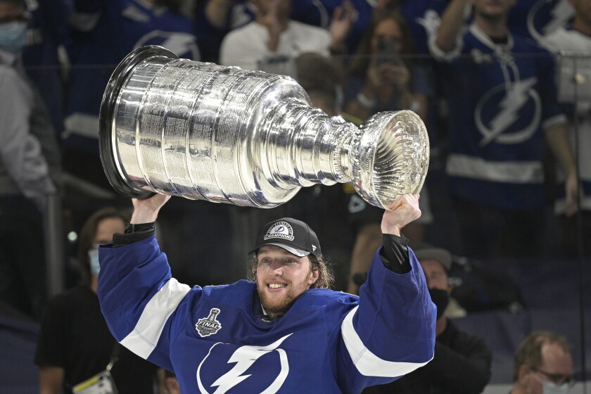 Tampa Bay Lightning goaltender Andrei Vasilevskiy hoists the Stanley Cup after the team defeated the Montreal Canadiens in Game 5 of the NHL hockey Stanley Cup finals, Wednesday, July 7, 2021, in Tampa, Fla. (AP Photo/Phelan Ebenhack)