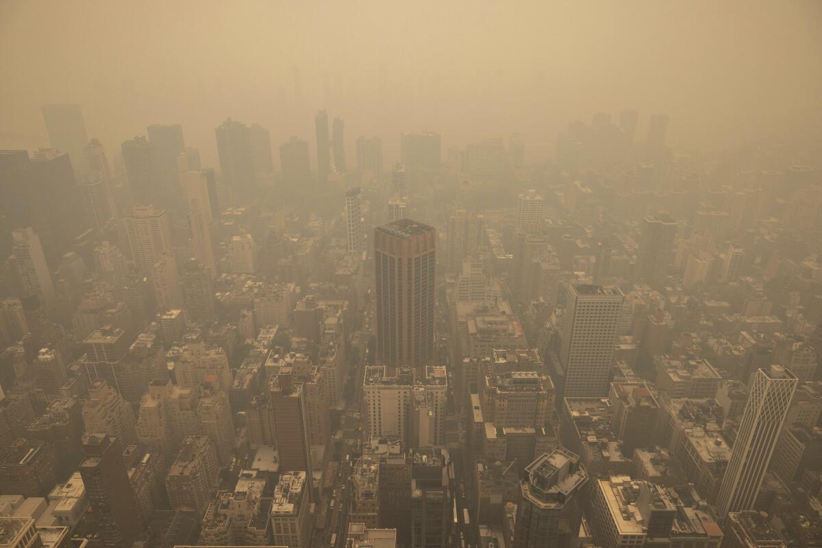 An aerial view of New York City shrouded in haze