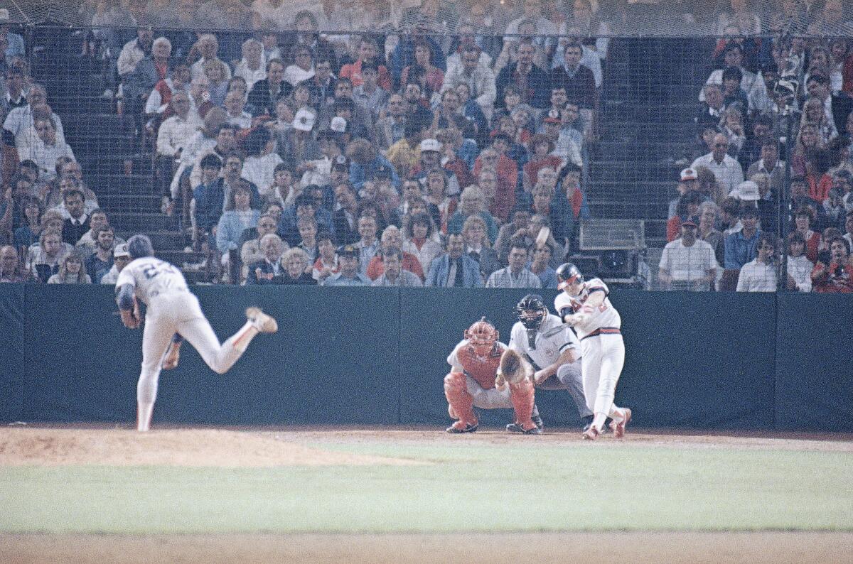 Angels' Dick Schofield hits a seventh-inning home run off Boston Red Sox pitcher Dennis Boyd.