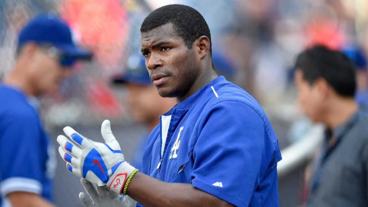 Dodgers outfielder Yasiel Puig looks on during batting practice before a game against the Nationals on July 19.