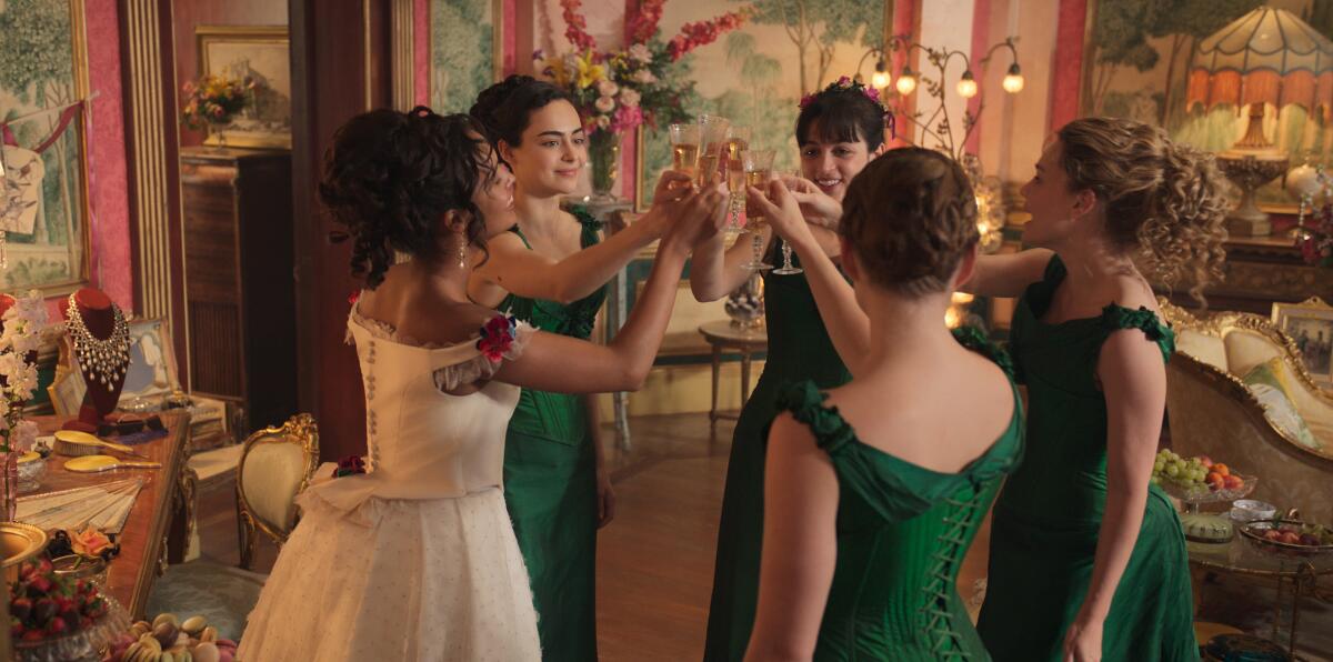 Five young women in Victorian London toast each other.