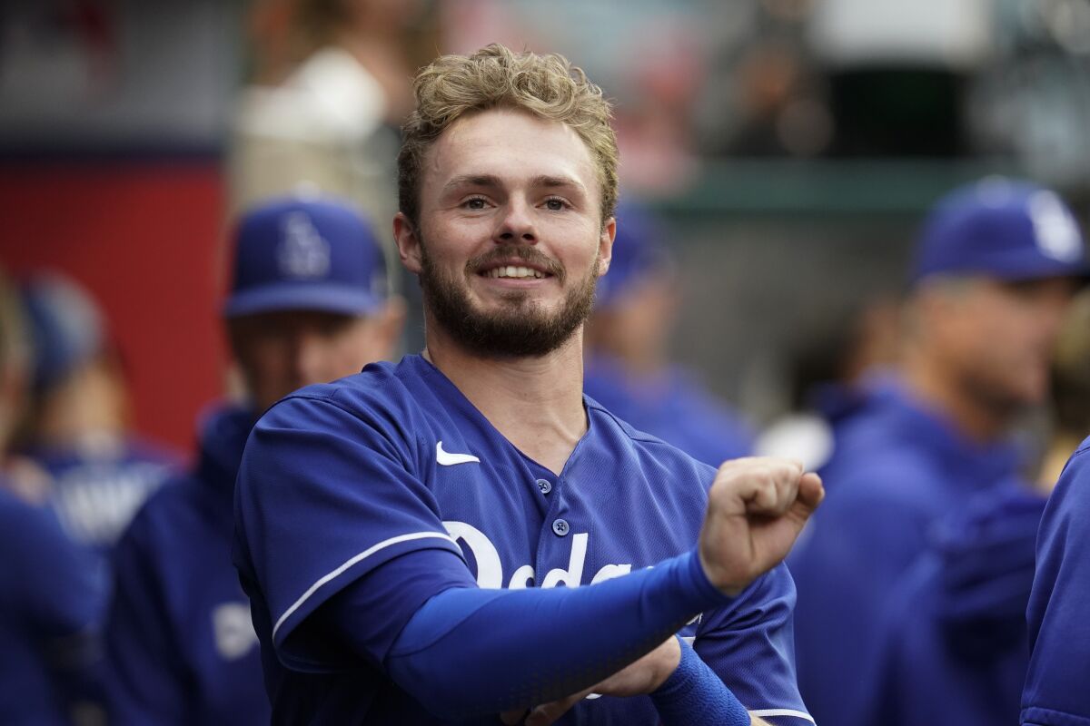 Los Angeles Dodgers second baseman Gavin Lux (9) stands in the dugout before a spring training baseball game