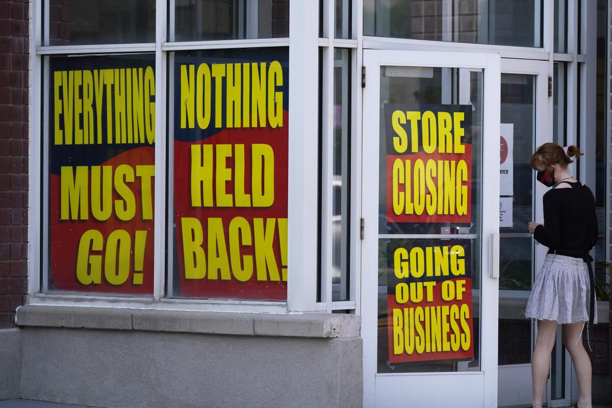 Store-closing signs on a Stein Mart in Salt Lake City