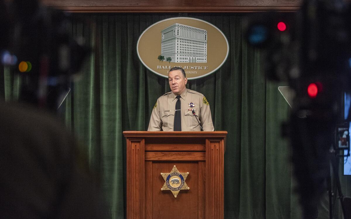 Los Angeles County Sheriff Alex Villanueva speaks at a lectern.
