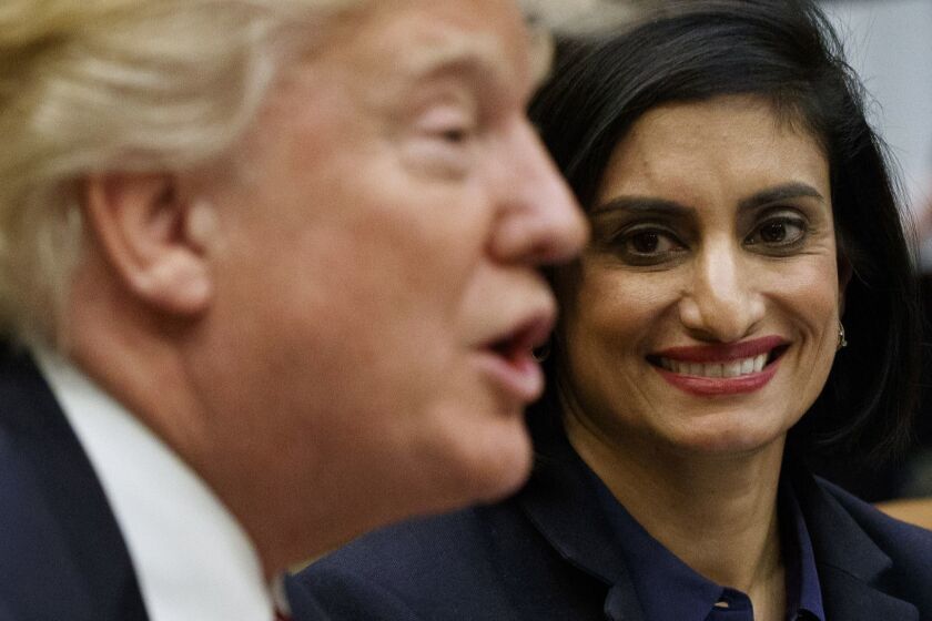 FILE - In this March 22, 2017 file photo, Administrator of the Centers for Medicare and Medicaid Services Seema Verma listen at right as President Donald Trump speaks during a meeting in the Roosevelt Room of the White House in Washington. Work requirements for Medicaid could lead to major changes in the social safety net under President Donald Trump. The question: Should adults who are able to work be required to do so to get taxpayer provided health insurance? (AP Photo/Evan Vucci, File)