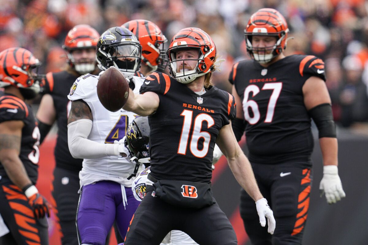 Bengals wide receiver Trenton Irwin (16) signals first down after making a catch against the Ravens.