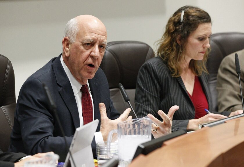 SAN DIEGO, February 9, 2016 | With board President Michelle O'Connor-Ratcliff sitting at right, School Superintendent John Collins speaks during a Poway Unified School District board meeting at Rancho Bernardo High School on Feb. 9. | -Mandatory Photo Credit: Photo by Hayne Palmour IV/San Diego Union-Tribune, LLC