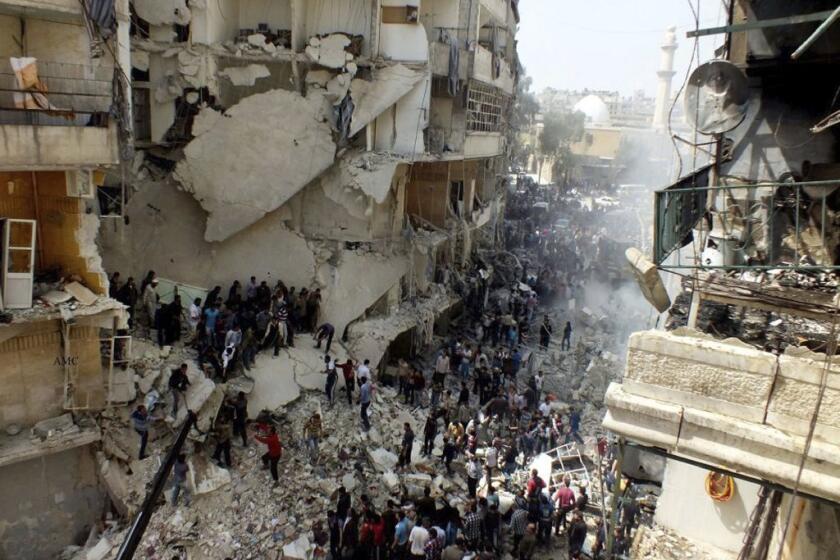 Civilians in Aleppo, Syria's largest city, search for survivors and bodies in the rubble of a building struck by an apparent airstrike.