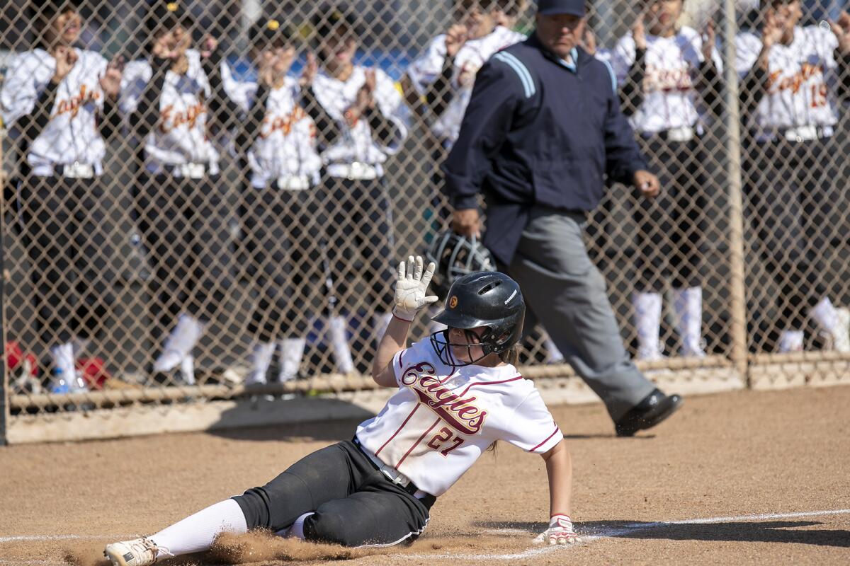 Estancia's Mikaila Gorey scores on a Jaydin McClure single in the third inning against Costa Mesa on Wednesday.
