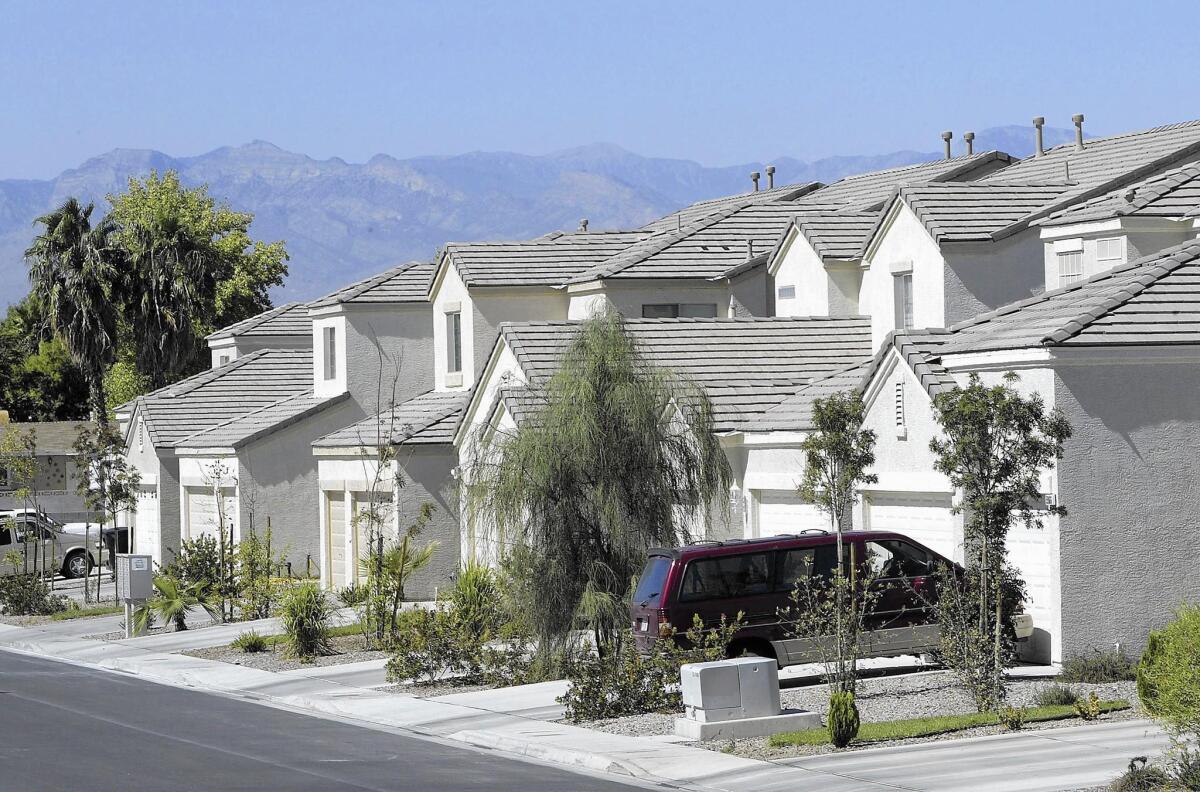 In Las Vegas, the traditional American front lawn has largely given way to desert-compatible landscaping, as seen here in 2004.