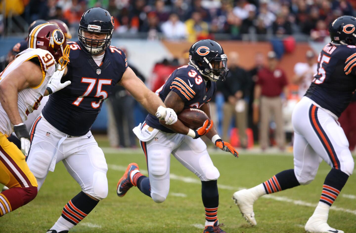 Chicago Bears offensive tackle Kyle Long (75) blocks on a run by running back Jeremy Langford (33) in the first quarter of a game at Soldier Field in Chicago on Dec. 13, 2015.