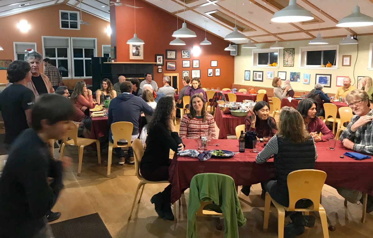 Cohousing communities feature a dining hall inside a common house where neighbors can socialize over meals