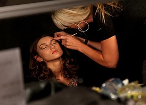 Georgie Wess Trump of Australia gets made up before models present the Rachel Roy spring 2010 collection.
