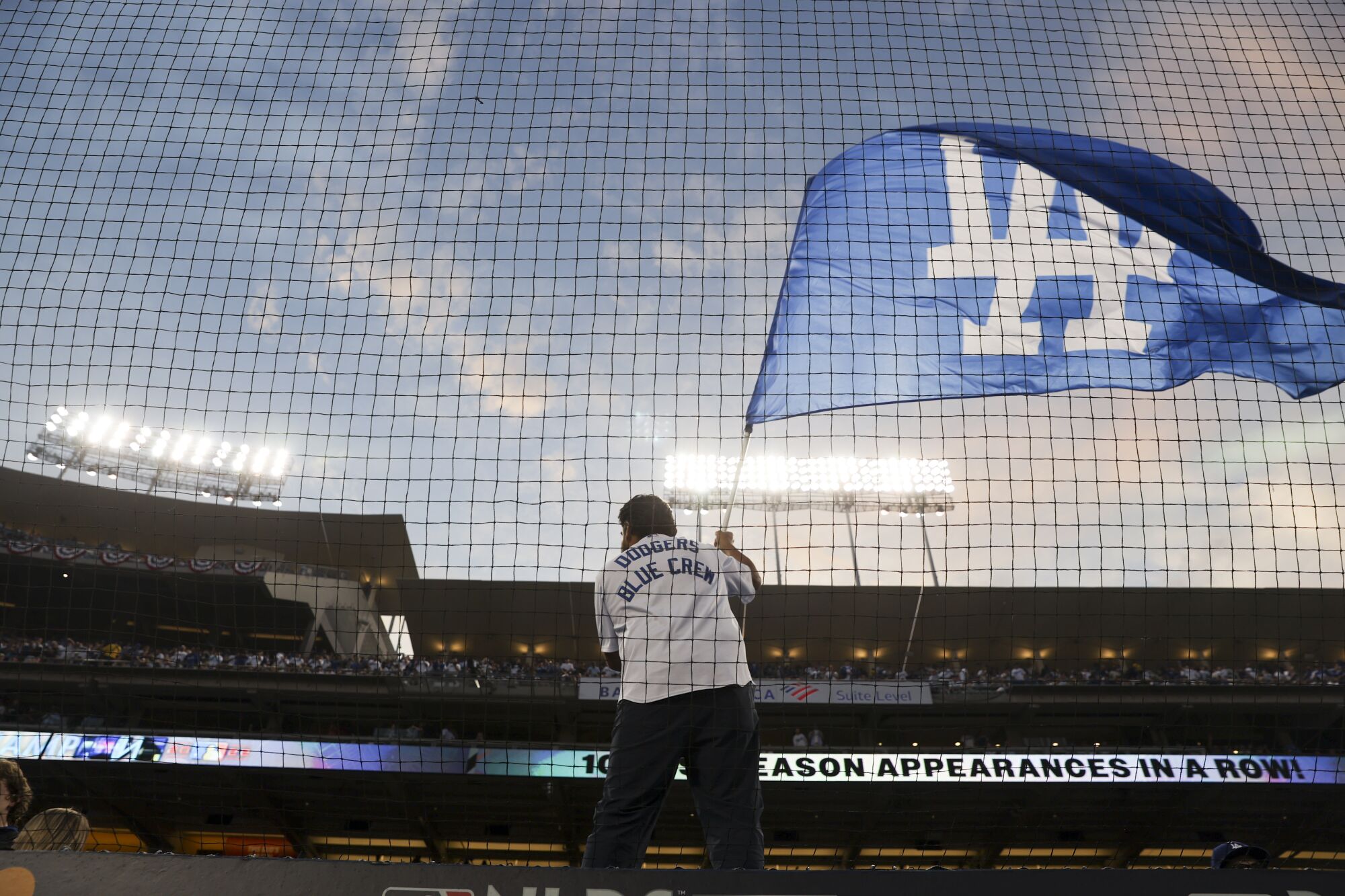 The Dodgers blue crew waves a flag before game one.