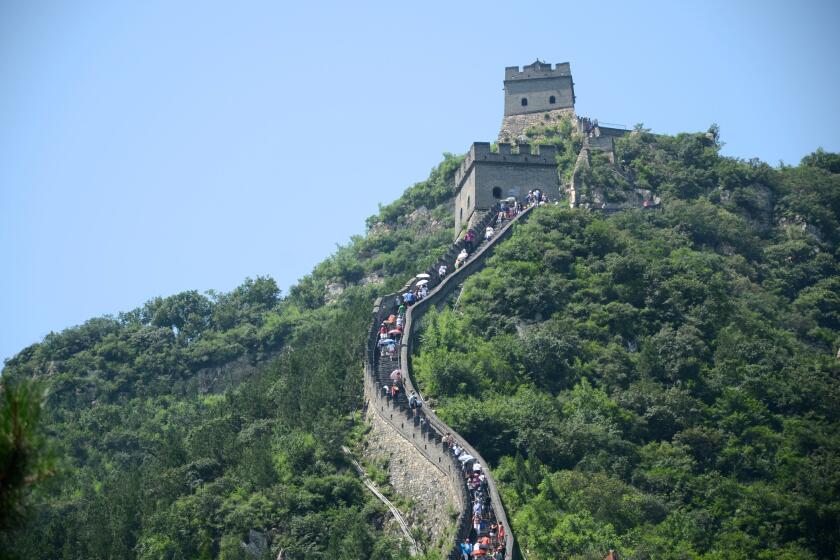 China's greatest landmark climbs a green hillside north of Beijing.