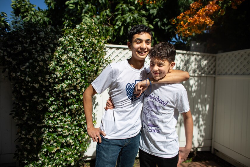 Sebastian Hernandez, 15, left, and brother Benjamin, 12, have thrived during the coronavirus pandemic. 