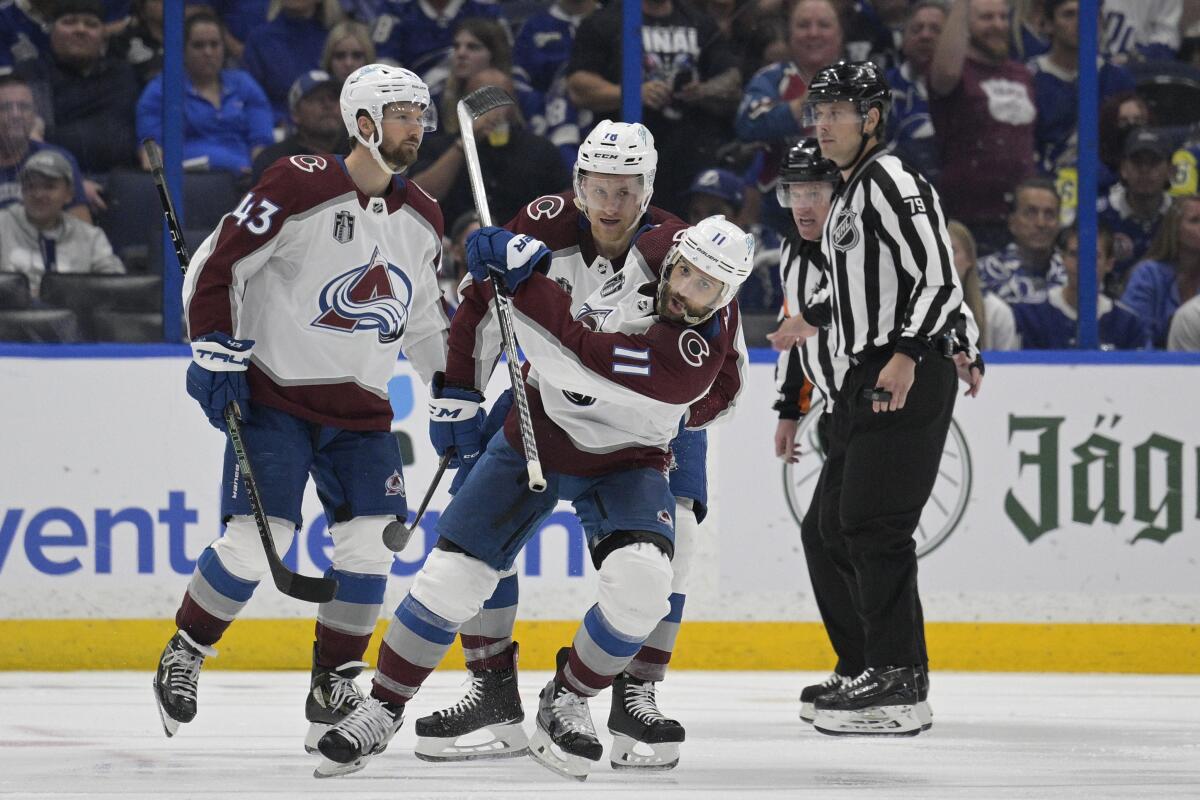 Colorado Avalanche center Andrew Cogliano (11) reacts after scoring during the third period of Game 4 of the NHL hockey Stanley Cup Finals against the Tampa Bay Lightning on Wednesday, June 22, 2022, in Tampa, Fla. (AP Photo/Phelan Ebenhack)