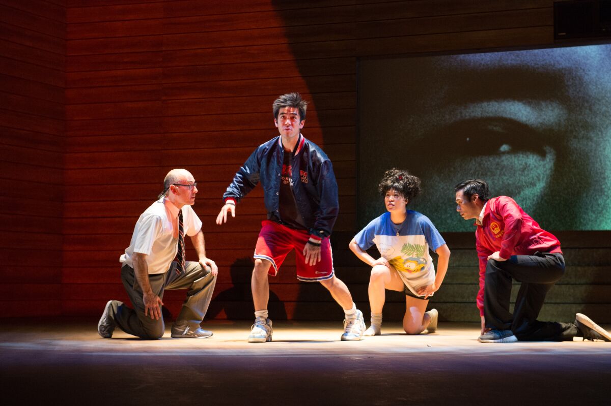 James Eckhouse, left, Justin Chien, Christine Lin and Grant Chang share the stage in "The Great Leap" at the Pasadena Playhouse.