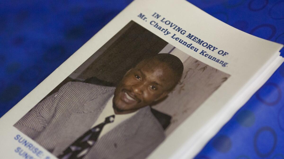 A program at the memorial service for Charly "Africa" Keunang, the unarmed homeless man killed by police on skid row in 2015.