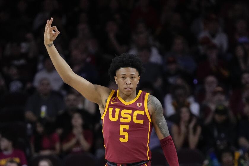 Southern California guard Boogie Ellis reacts after scoring a three point basket during the first half of an NCAA college basketball game against UCLA, Saturday, Jan. 27, 2024, in Los Angeles. (AP Photo/Ryan Sun)