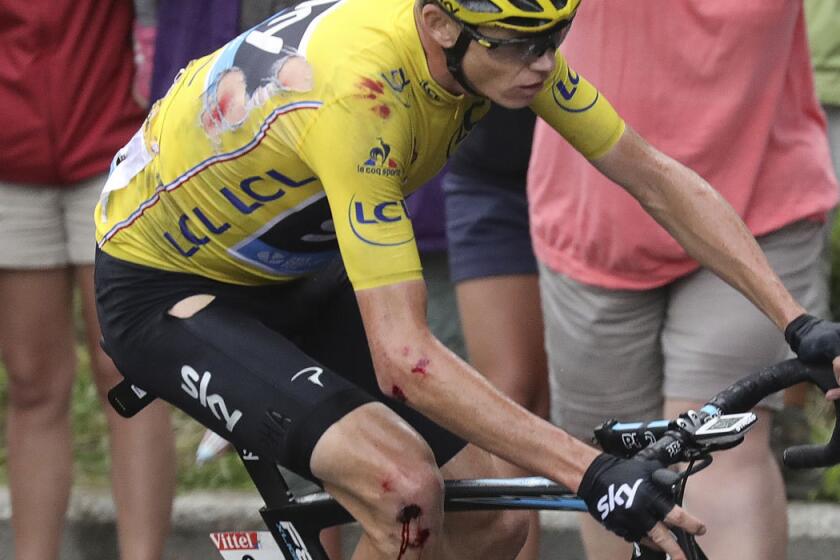 Chris Froome continues racing after a crash during Stage 19 of the Tour de France.