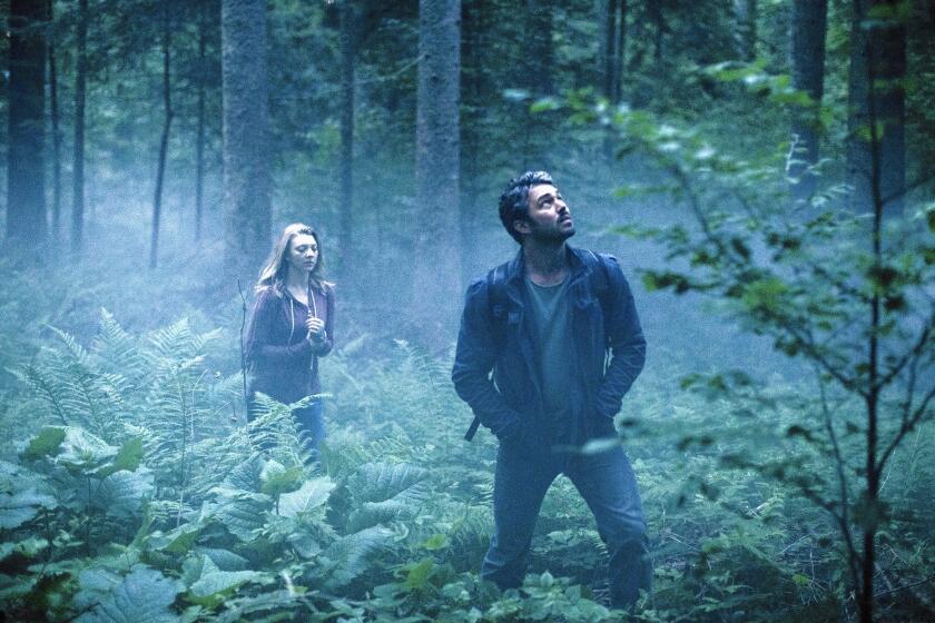 Natalie Dormer and Taylor Kinney in "The Forest."