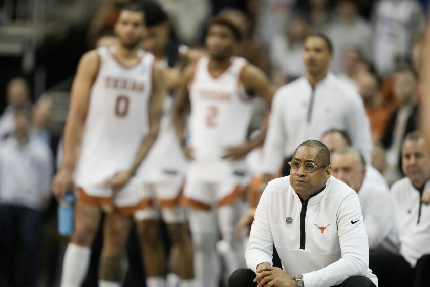 Texas head coach Rodney Terry watches during their loss against Miami in an Elite 8 college basketball game in the Midwest Regional of the NCAA Tournament Sunday, March 26, 2023, in Kansas City, Mo. (AP Photo/Charlie Riedel)