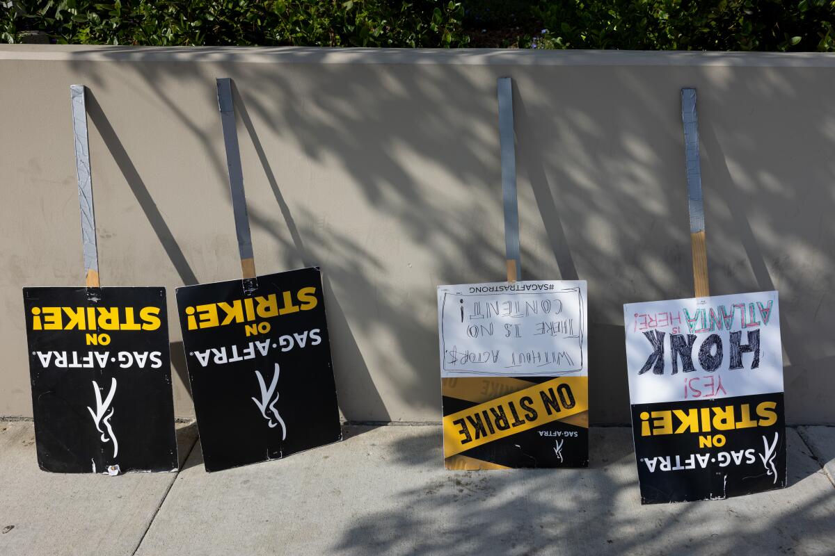 SAG-AFTRA picket signs have been laid down after the union reached a deal with studios.
