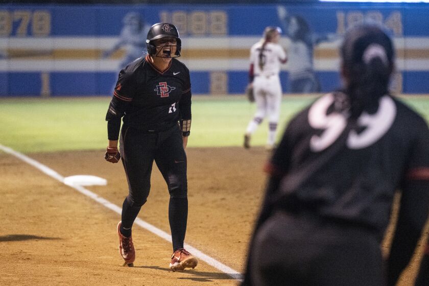 San Diego State's Cali Decker reacts on her three-run home run during an NCAA softball game against Liberty on Friday, May 19, 2023, in Los Angeles. (AP Photo/Kyusung Gong)